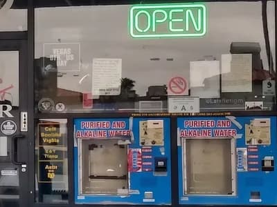 Purified and alkaline water refill machines with OPEN sign at Red Rock Springs Water, 9132 W Sahara Ave, Las Vegas